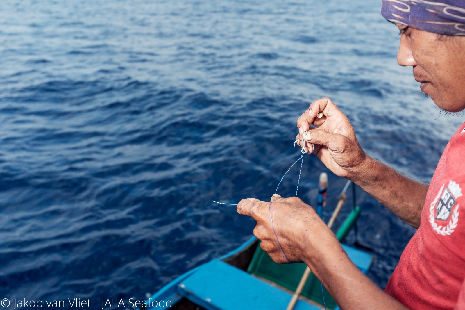 Fisher holding fishing line